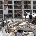 Reportan dos personas con posible vida en un edificio de Venezuela